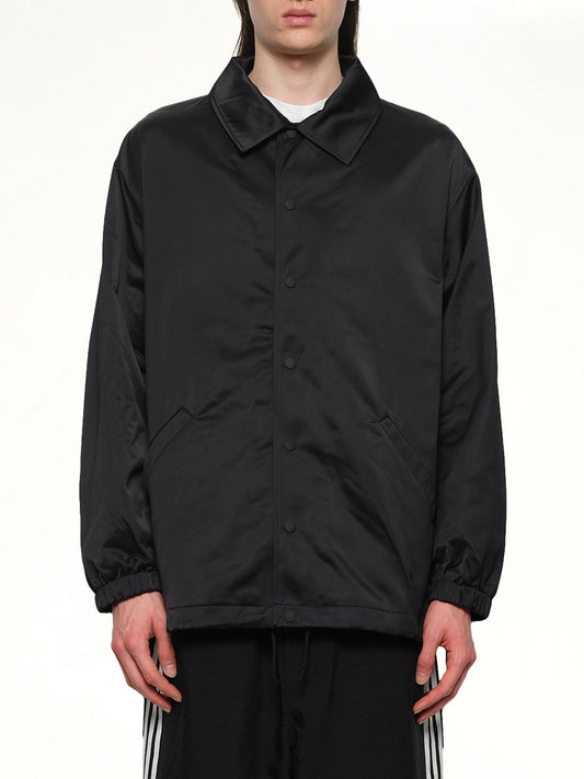 Image of a model wearing Outerwear. Productname: Y-3 Logo Graphic Coach Jacket in Black colour by brand - Y-3