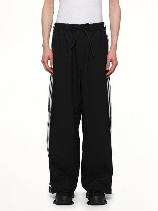 Image of a model wearing Uniforms & Workwear. Productname: Y-3 Sport Uniform Pants 3-Stripes in Black colour by brand - Y-3