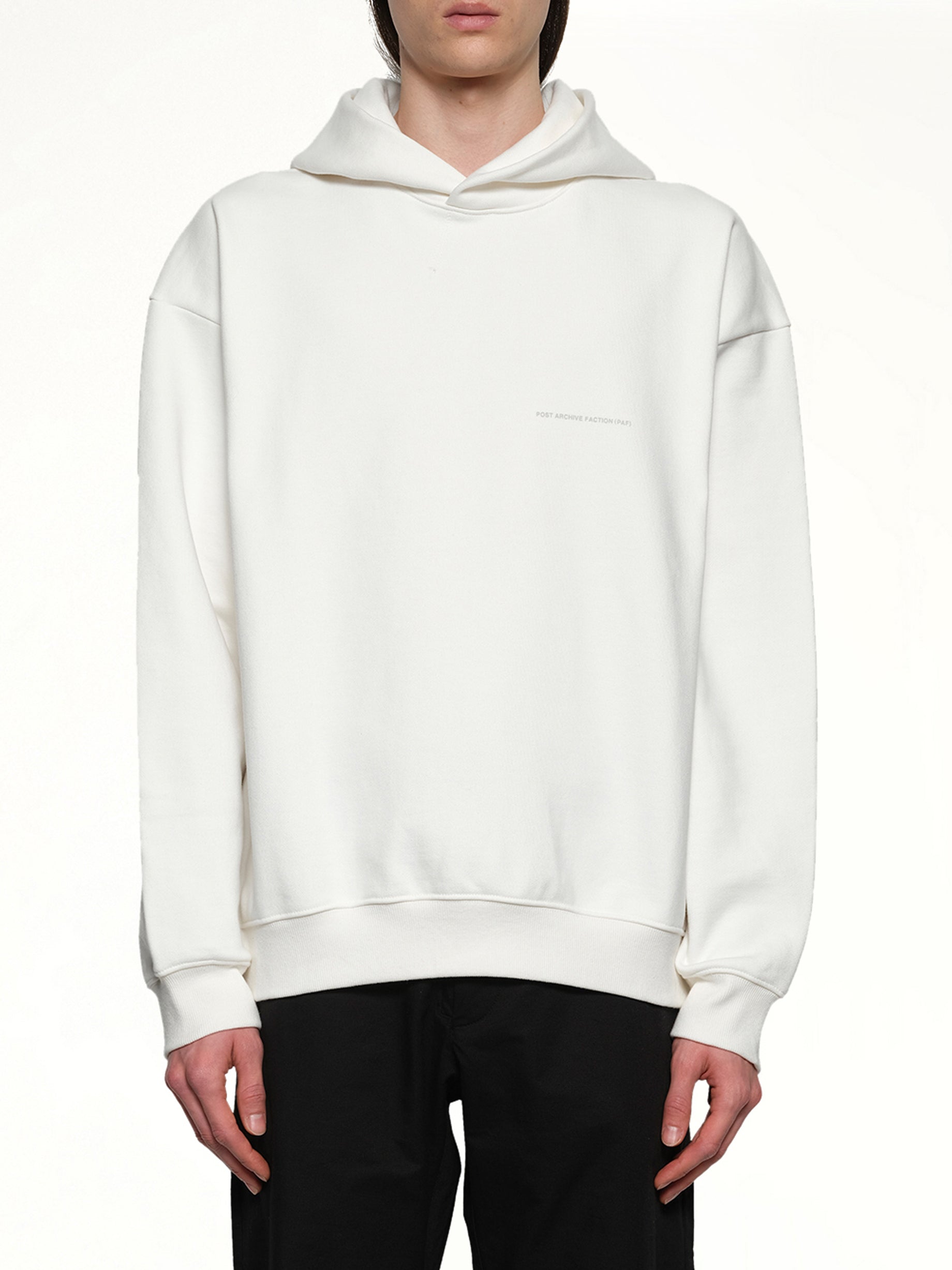 Image of a model wearing Outerwear. Productname: POST ARCHIVE FACTION Work Hoodie (Archive) in White colour by brand - POST ARCHIVE FACTION