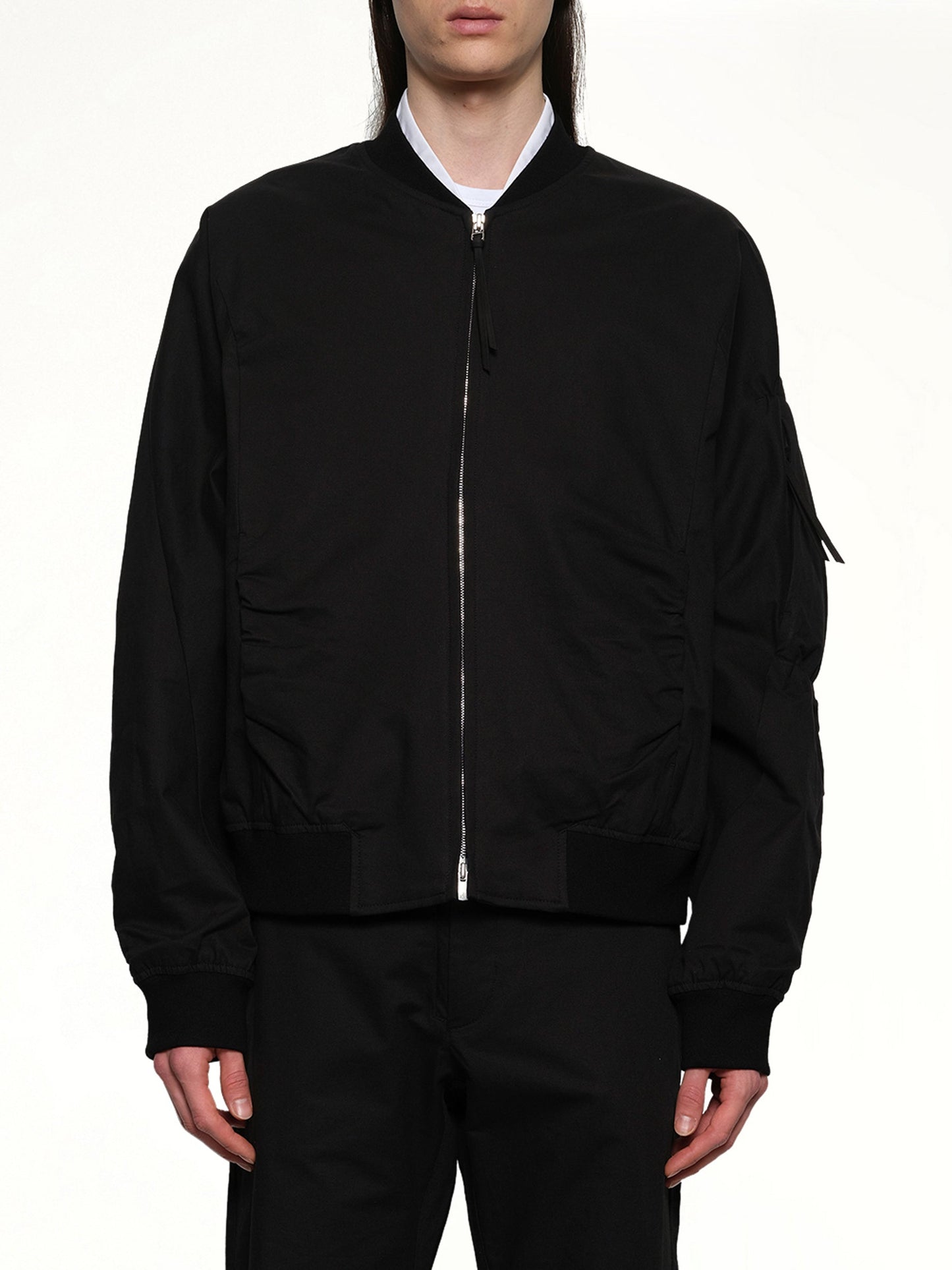 Image of a model wearing Outerwear. Productname: POST ARCHIVE FACTION Shirring Bomber in Black colour by brand - POST ARCHIVE FACTION
