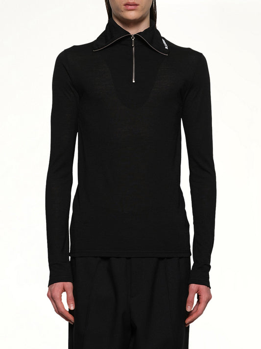 Image of a model wearing Tops. Productname: JIL SANDER Zip Up High Neck Long Sleeve T-Shirt in BLACK colour by brand - JIL SANDER