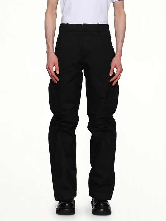 Image of a model wearing Pants. Productname: POST ARCHIVE FACTION Shirring Pants in Black colour by brand - POST ARCHIVE FACTION