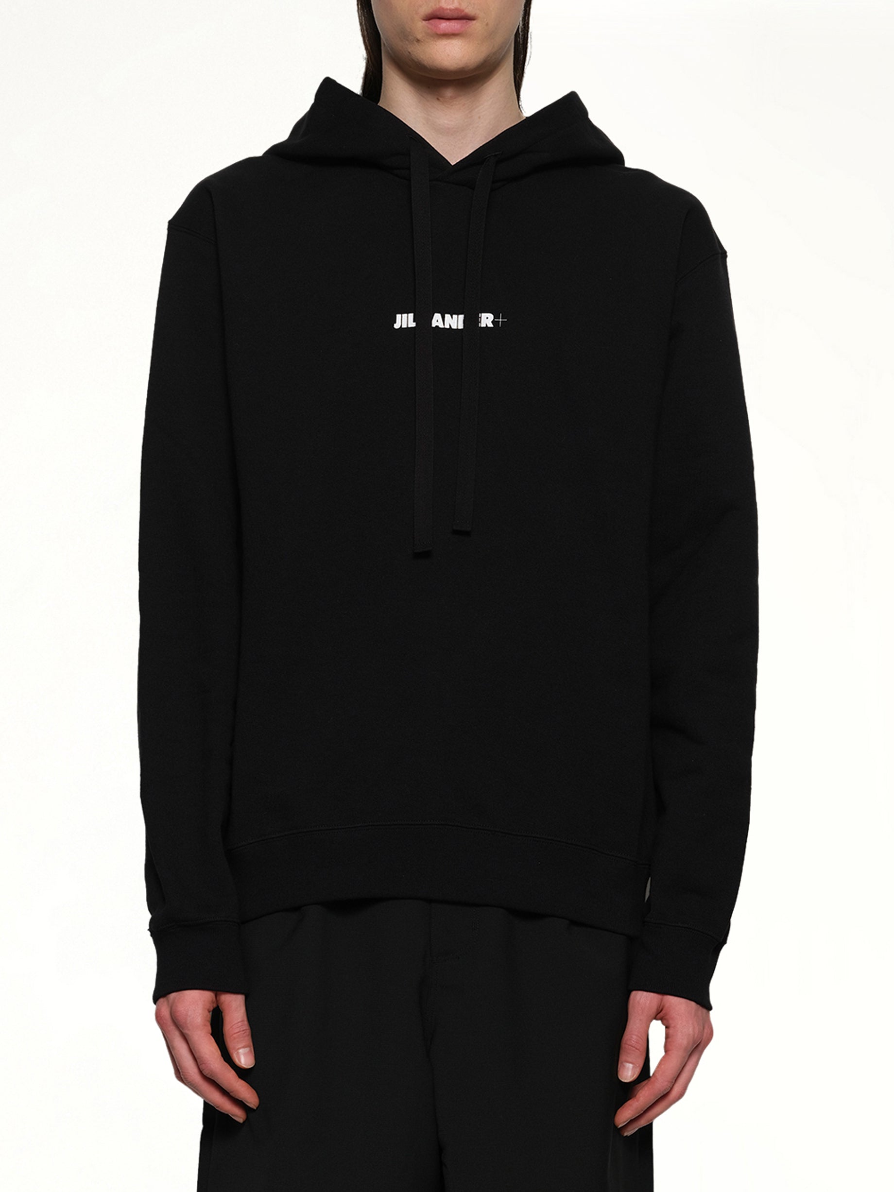 Image of a model wearing Outerwear. Productname: JIL SANDER Plus Compact Terry Hoodie in BLACK colour by brand - JIL SANDER