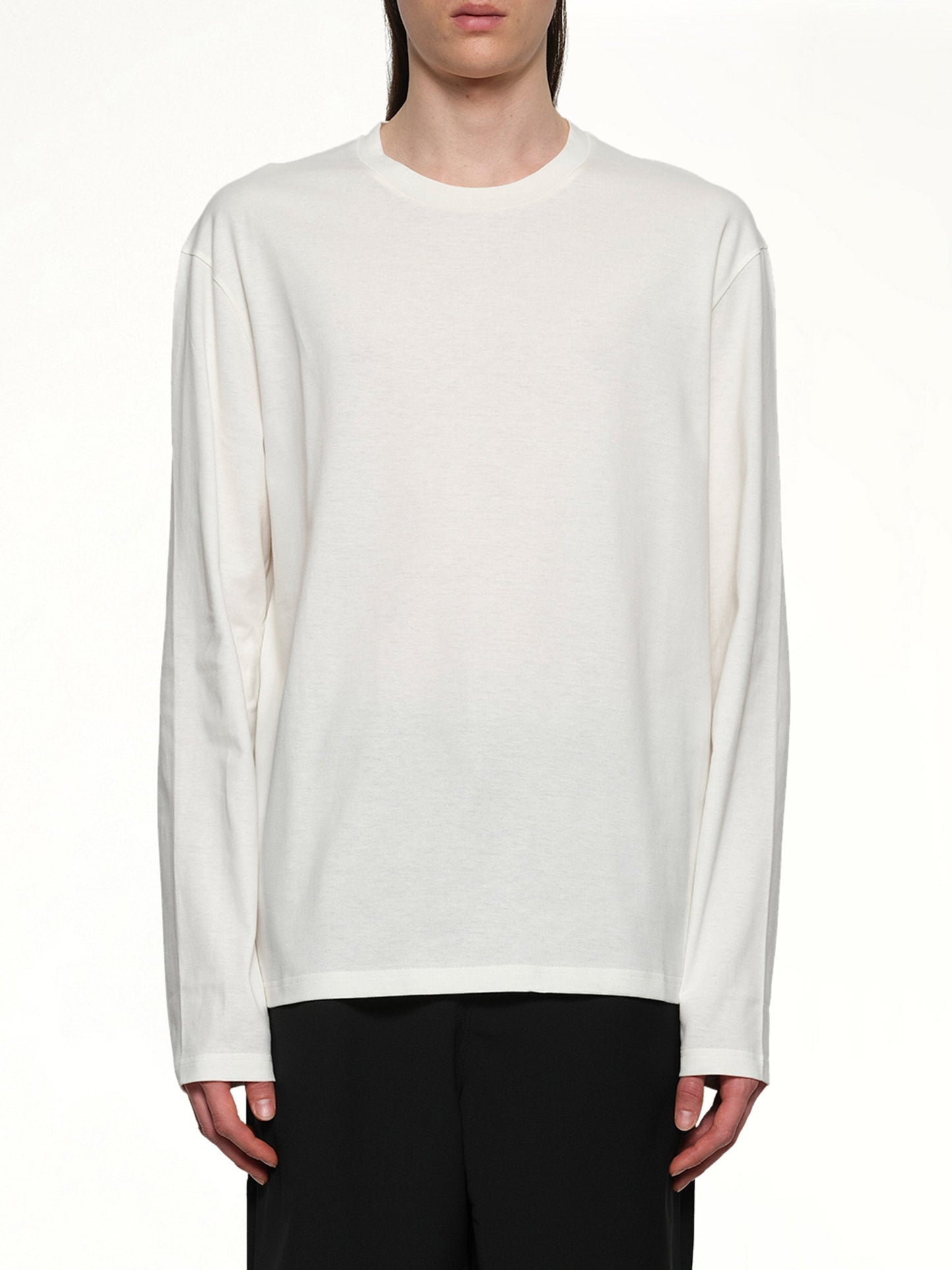 Image of a model wearing Tops. Productname: JIL SANDER Long Sleeve Logo T-Shirt in COCONUT colour by brand - JIL SANDER