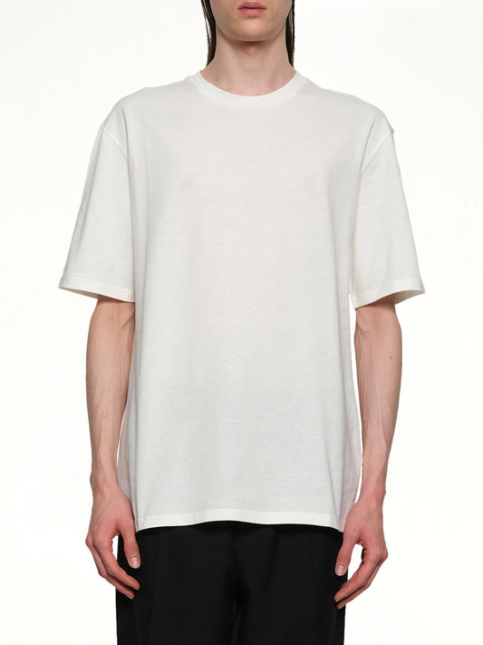 Image of a model wearing Tops. Productname: JIL SANDER Logo T-Shirt in COCONUT colour by brand - JIL SANDER