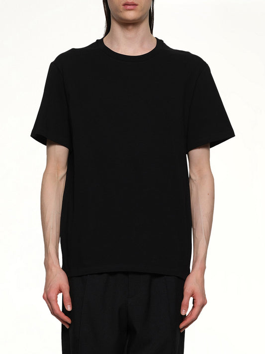 Image of a model wearing Tops. Productname: JIL SANDER Leather Patch T-Shirt in BLACK colour by brand - JIL SANDER