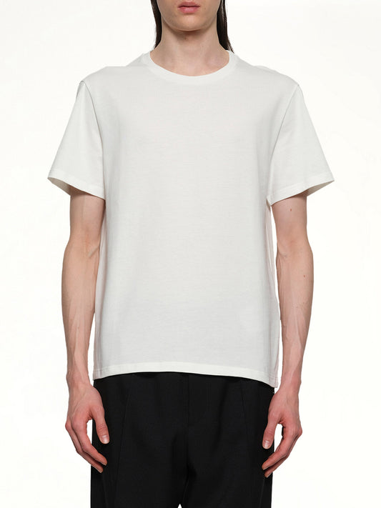 Image of a model wearing Tops. Productname: JIL SANDER Leather Patch T-Shirt in PORCELAIN colour by brand - JIL SANDER