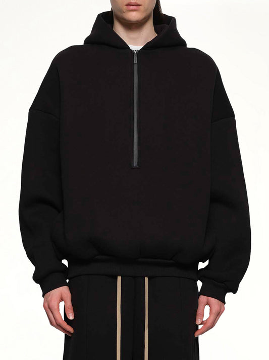 Image of a model wearing Outerwear. Product name - Athletic Halfzip Hoodie in Black colour by brand - FEAR OF GOD