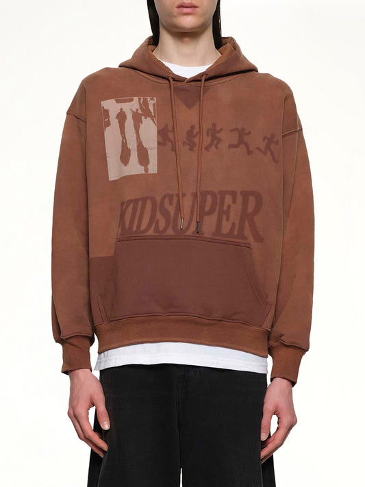 Image of a model wearing Outerwear. Productname: KID SUPER Sun Faded Hoodie in Brown colour by brand - KID SUPER