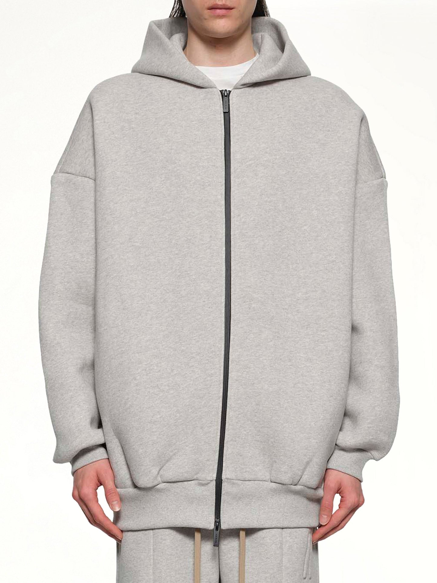 Image of a model wearing Outerwear. Product name - Zip Hoodie in Grey colour by brand - FEAR OF GOD