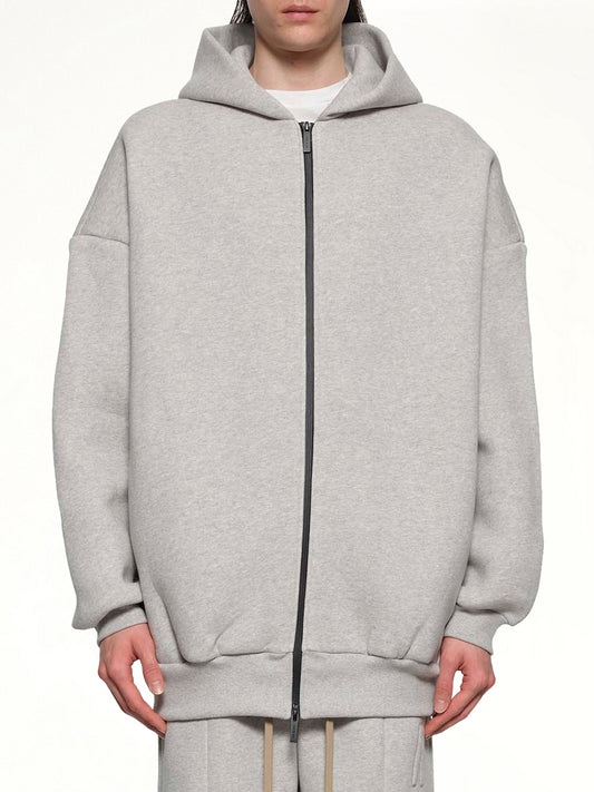Image of a model wearing Outerwear. Product name - Zip Hoodie in Grey colour by brand - FEAR OF GOD