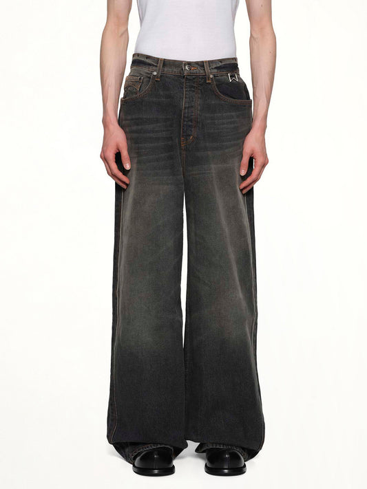 Image of a model wearing Denim. Productname: RHUDE Wide Leg Traxedo Denim in AGOURA BLACK colour by brand - RHUDE