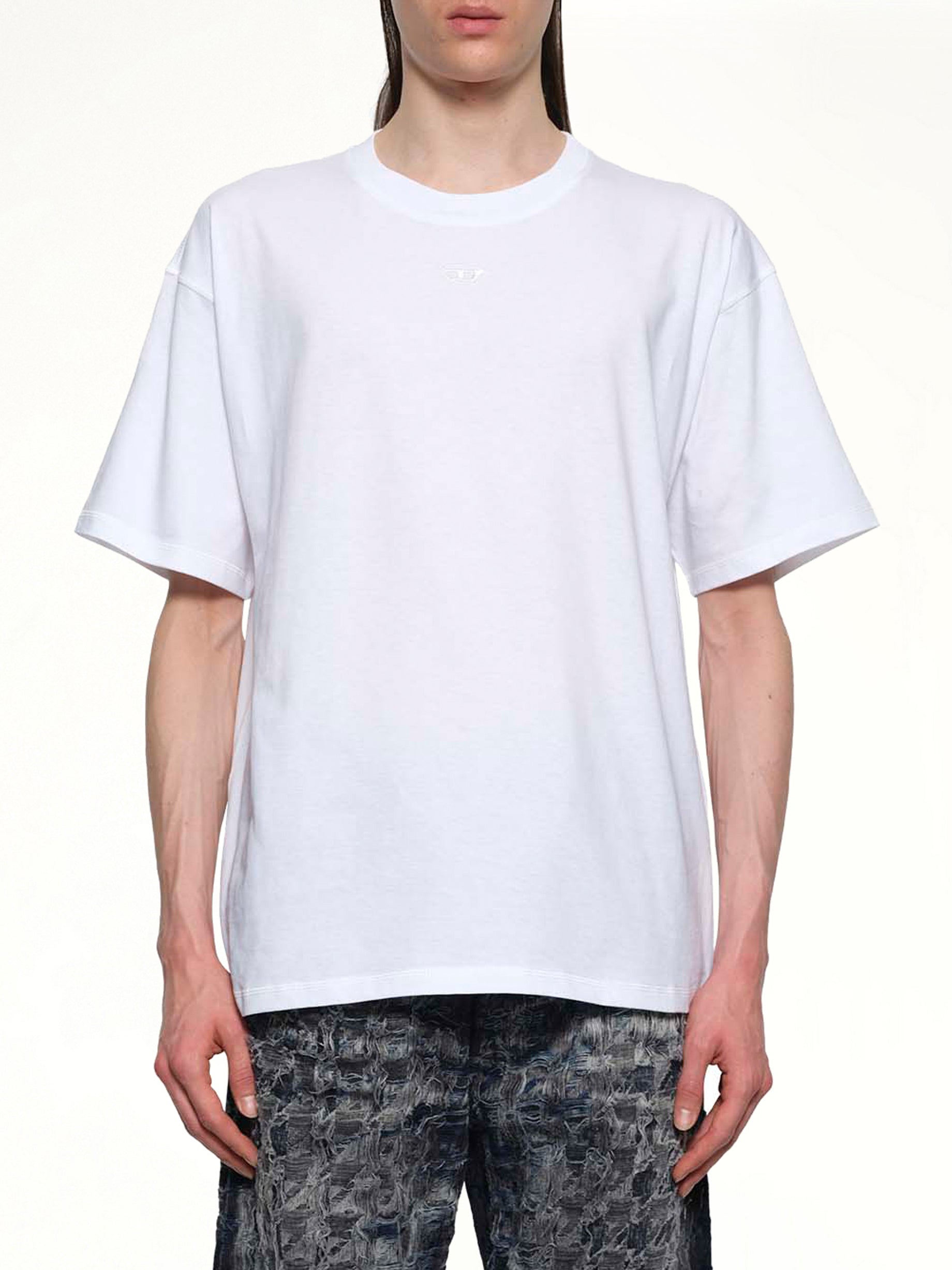 Image of a model wearing Tops. Productname: DIESEL T-LUCIEN-IHBI T-Shirt in White colour by brand - DIESEL