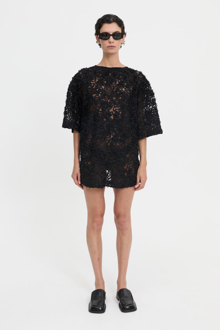 Image of a model wearing Tops. Product name - Delmare Mini Dress in Dress colour by brand - Blanca Studio