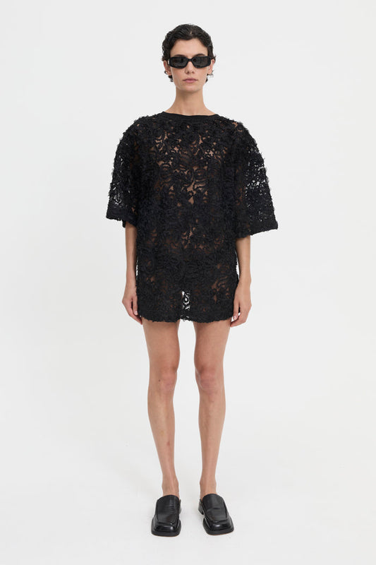 Image of a model wearing Tops. Product name - Delmare Mini Dress in Dress colour by brand - Blanca Studio