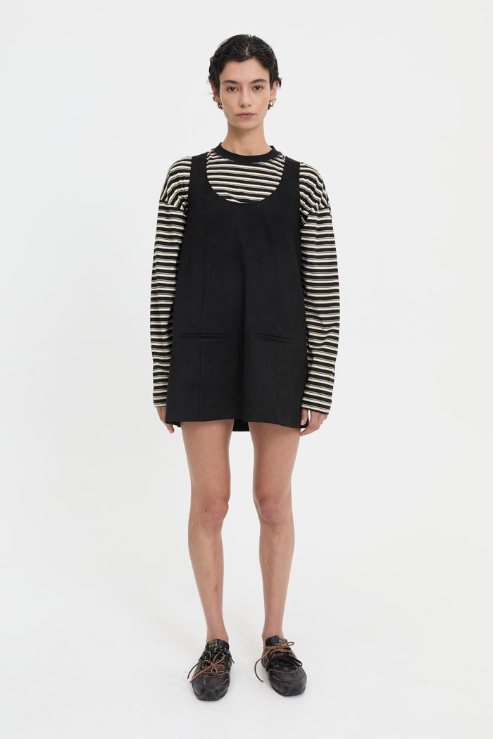 Image of a model wearing Tops. Product name - Hana Long Sleeve Tee Black in Black colour by brand - Blanca Studio