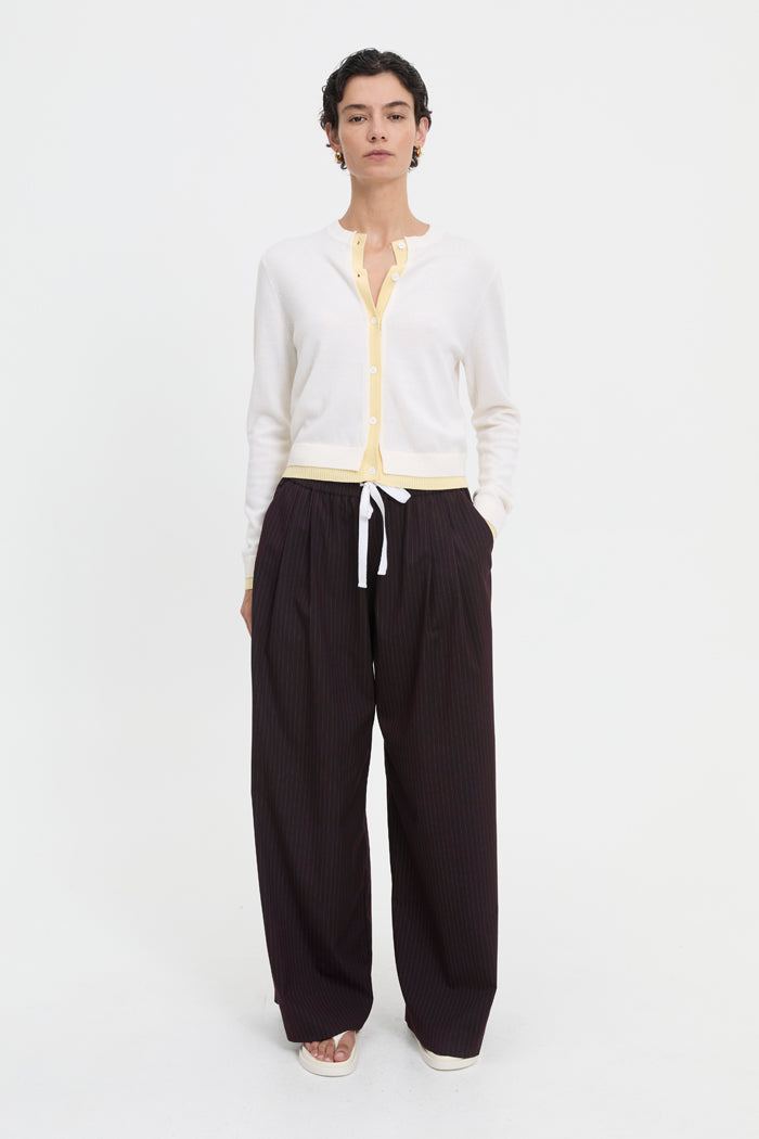 Image of a model wearing Outerwear. Product name - Roy Cardigan Butter in Butter colour by brand - Blanca Studio