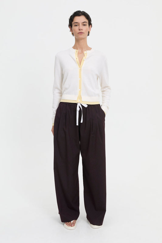 Image of a model wearing Outerwear. Product name - Roy Cardigan Butter in Butter colour by brand - Blanca Studio