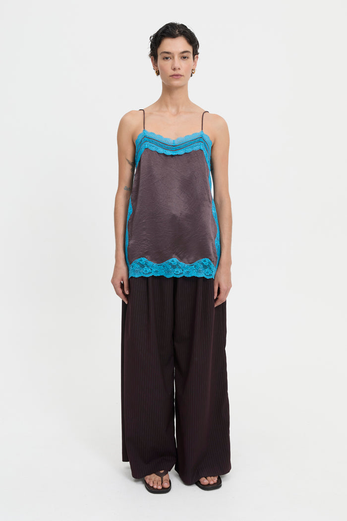 Image of a model wearing Tops. Product name - Lily Tank Brown in Brown colour by brand - Blanca Studio