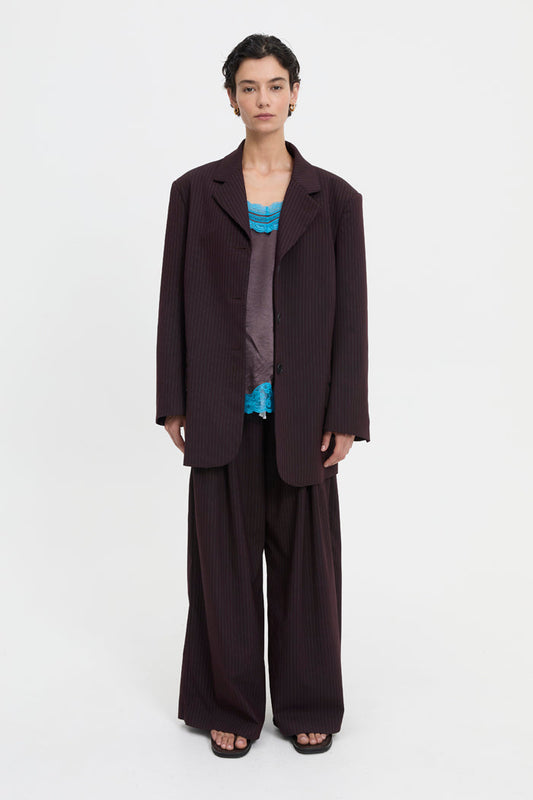 Image of a model wearing Outerwear. Product name - Mavis Blazer Brown in Brown colour by brand - Blanca Studio
