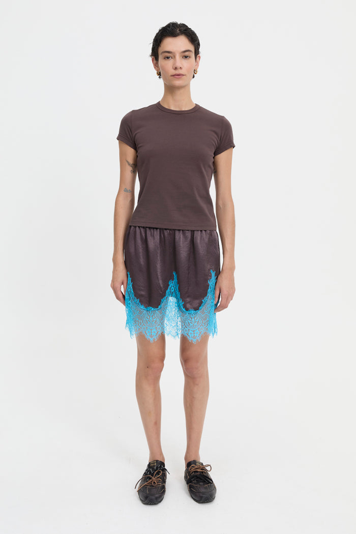 Image of a model wearing Skirts. Product name - Lily Skirt Brown in Brown colour by brand - Blanca Studio