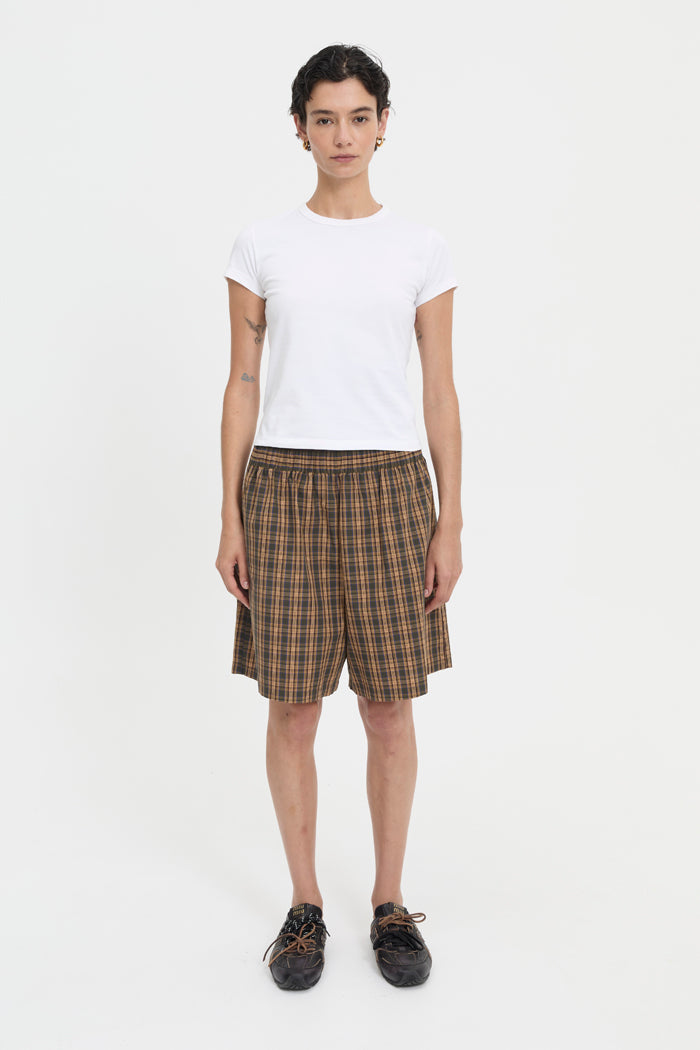 Image of a model wearing Shorts. Product name - Pascale Shorts Brown in Brown colour by brand - Blanca Studio