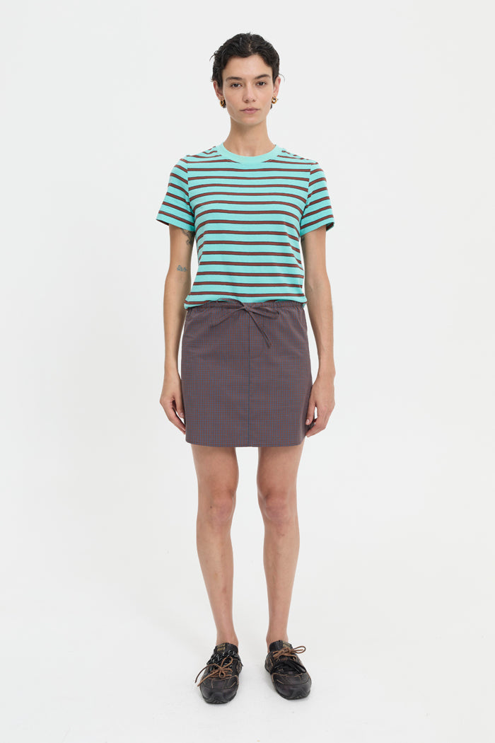 Image of a model wearing Skirts. Product name - Maja Skirt Coffee in Coffee colour by brand - Blanca Studio