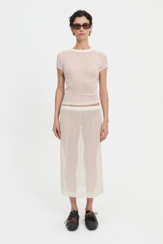 Image of a model wearing Skirts. Product name - Orla Skirt Cream in Cream colour by brand - Blanca Studio