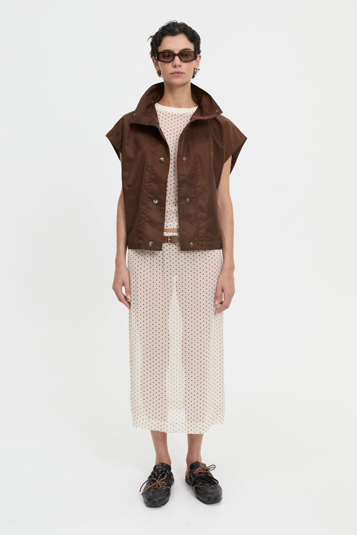Image of a model wearing Tops. Product name - Virgo Vest Brown in Brown colour by brand - Blanca Studio