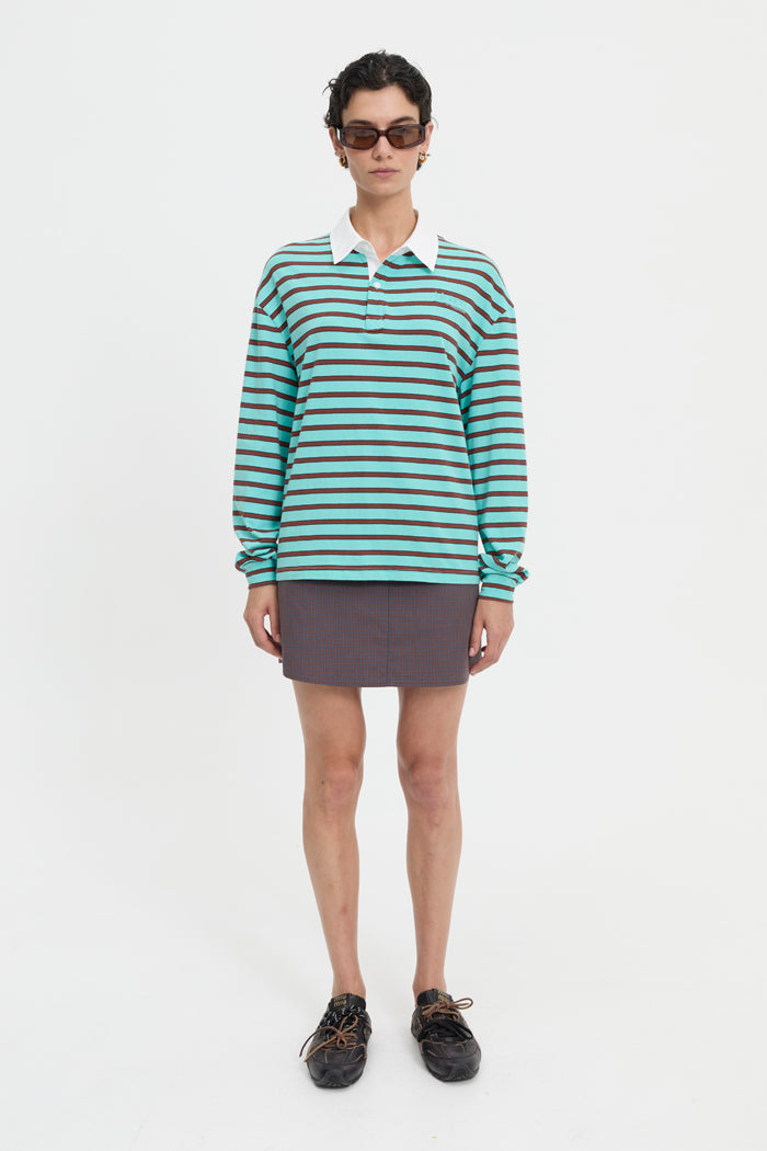Image of a model wearing Tops. Product name - Ellie Polo Turquoise in Turquoise colour by brand - Blanca Studio