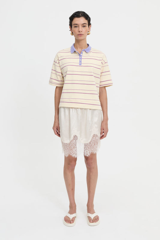 Image of a model wearing Tops. Product name - Natalini Polo Cream in Cream colour by brand - Blanca Studio