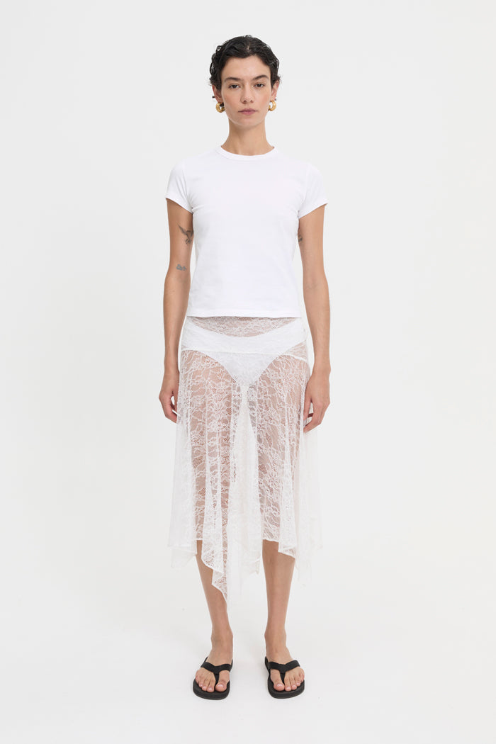 Image of a model wearing Skirts. Product name - Juni Skirt White in White colour by brand - Blanca Studio