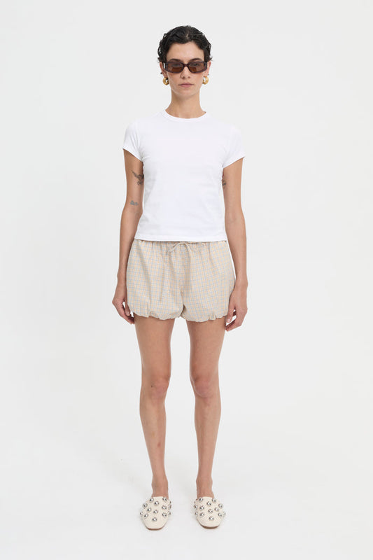 Image of a model wearing Shorts. Product name - Isley Shorts Cream in Cream colour by brand - Blanca Studio