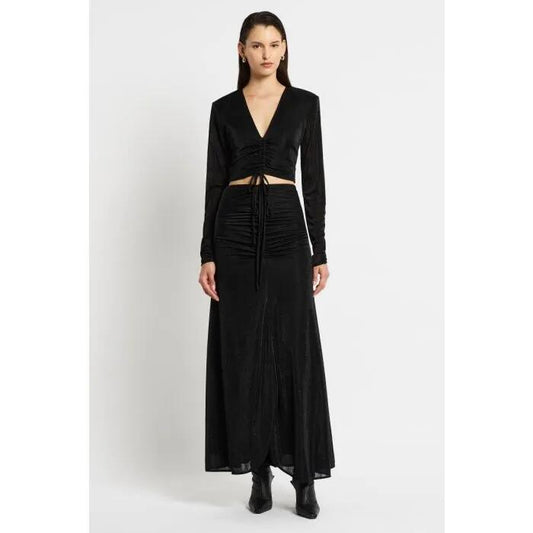 Image of a model wearing Skirts. Productname: Mezzanine Skirt in Black colour by brand - sass and bide