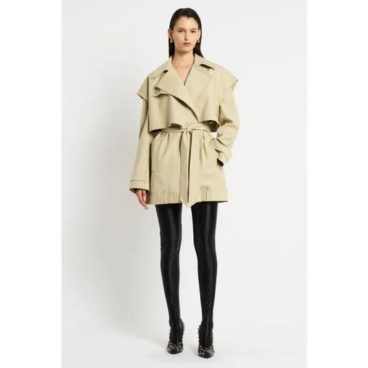 Image of a model wearing Outerwear. Productname: Permanence Short Trench in Tan colour by brand - sass and bide