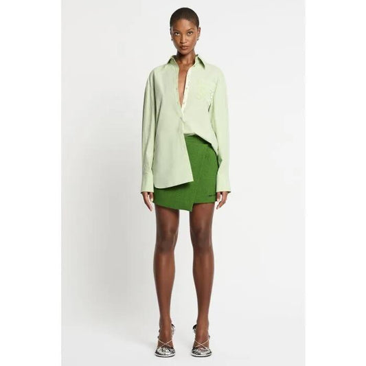 Image of a model wearing Skirts. Productname: Detour Skirt in Green colour by brand - sass and bide