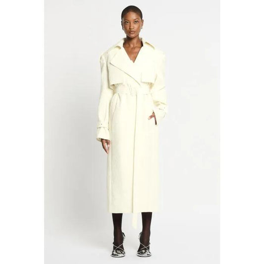 Image of a model wearing Outerwear. Productname: Age Of Anaconda Trench Coat in Cream colour by brand - sass and bide