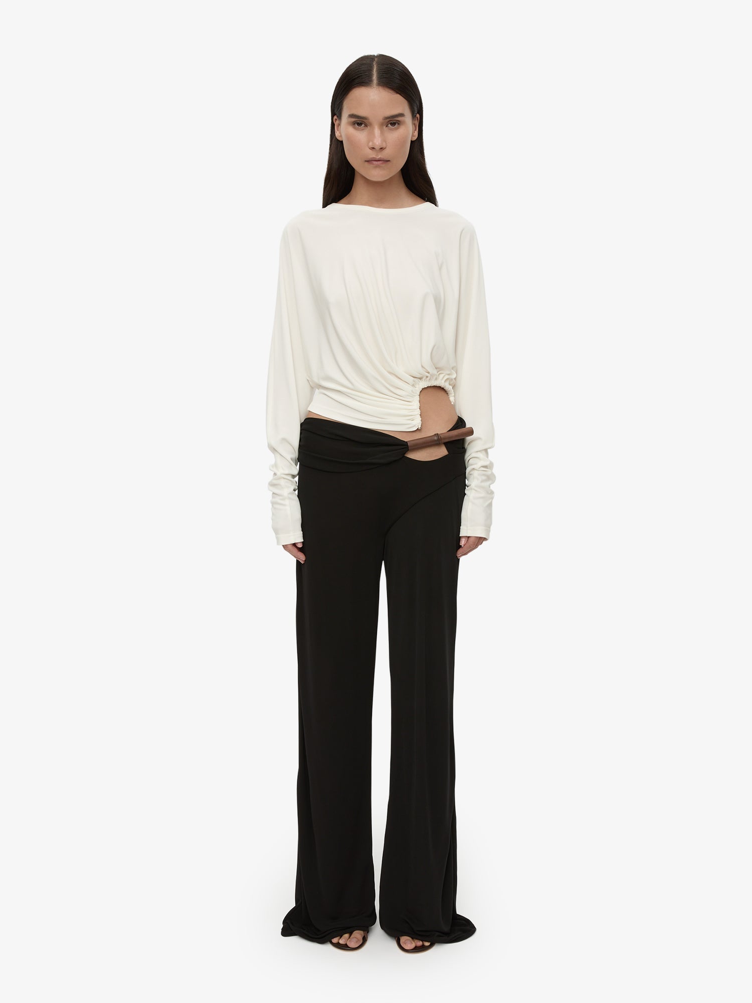 Image of a model wearing Pants. Product name - Chime Trouser in Black colour by brand - CHRISTOPHER ESBER