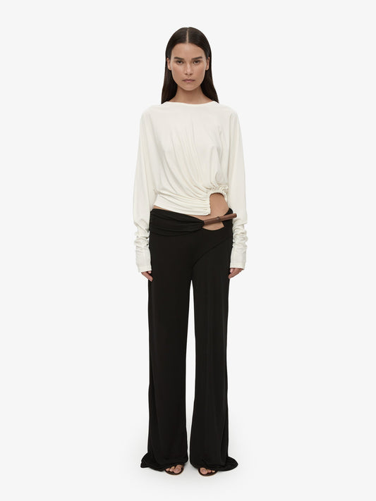 Image of a model wearing Pants. Product name - Chime Trouser in Black colour by brand - CHRISTOPHER ESBER