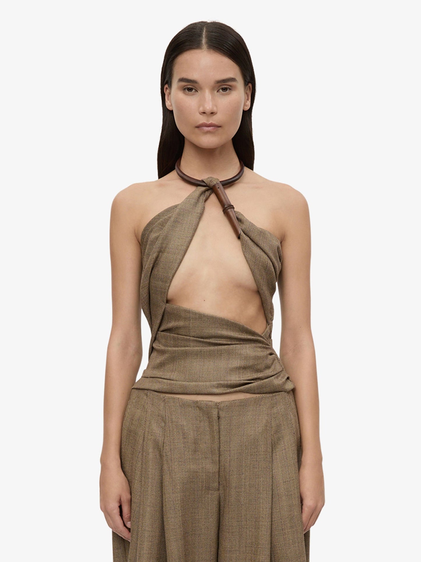 Image of a model wearing Tops. Product name - Chime Necklace Herringbone Halter Top in Brown colour by brand - CHRISTOPHER ESBER