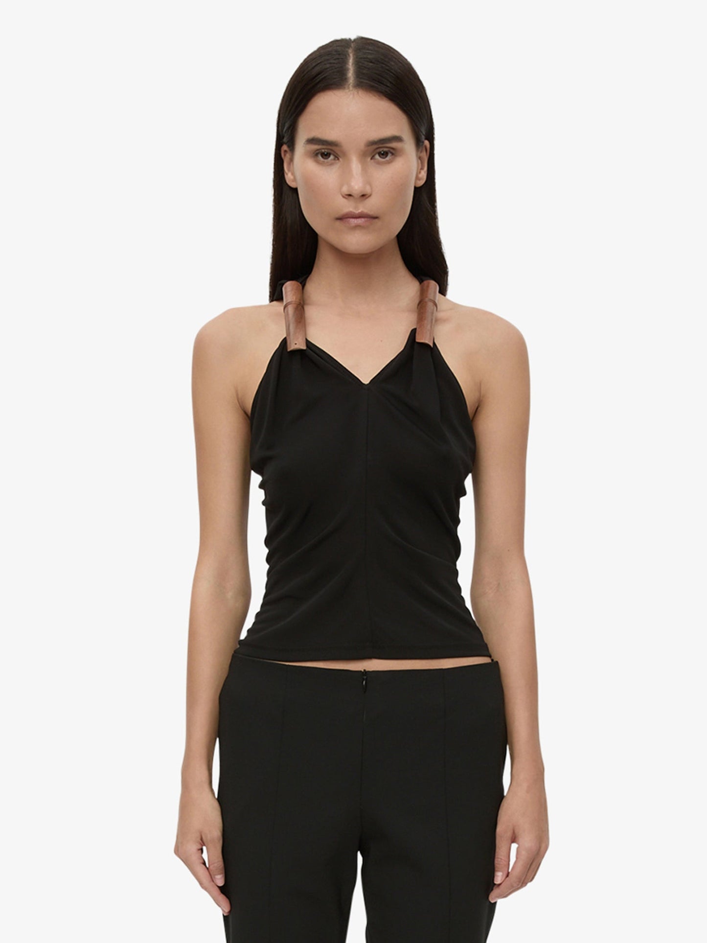 Image of a model wearing Tops. Product name - Wind Chime Tank in Black colour by brand - CHRISTOPHER ESBER