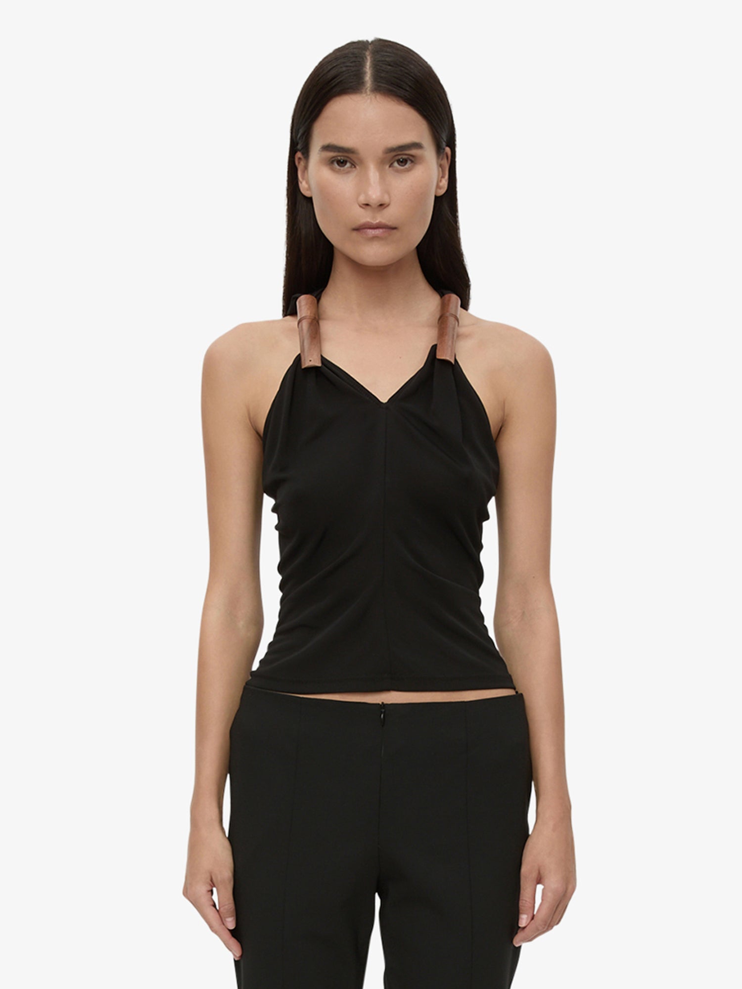 Image of a model wearing Tops. Product name - Wind Chime Tank in Black colour by brand - CHRISTOPHER ESBER
