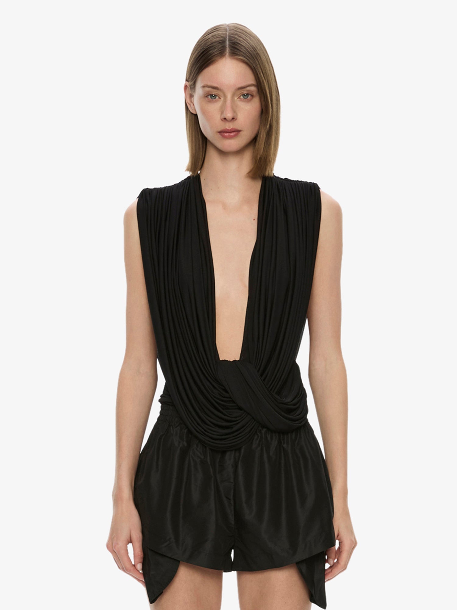 Image of a model wearing Tops. Productname: Ripple Drape Top in Black colour by brand - CHRISTOPHER ESBER