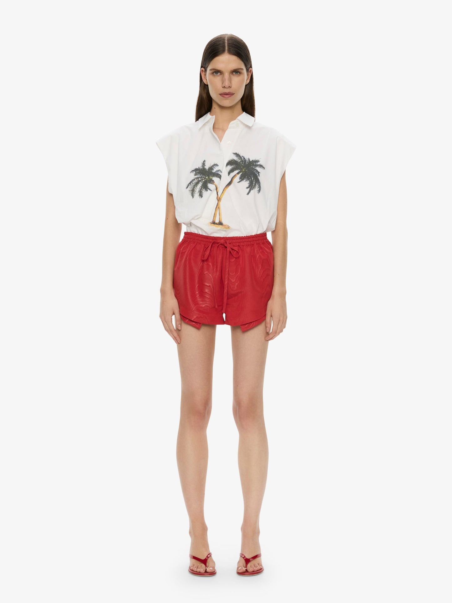 Image of a model wearing Shorts. Productname: Moire Archie Runner in Red colour by brand - CHRISTOPHER ESBER