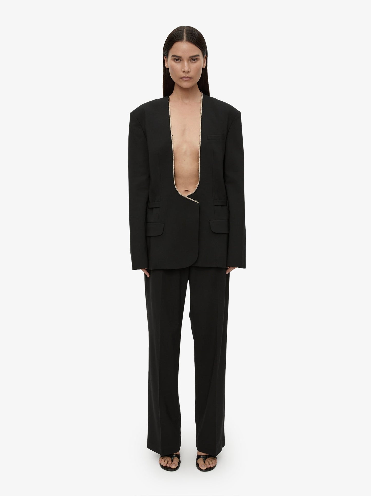 Image of a model wearing Pants. Productname: CHRISTOPHER ESBER Redux Wool Trouser in Black colour by brand - CHRISTOPHER ESBER