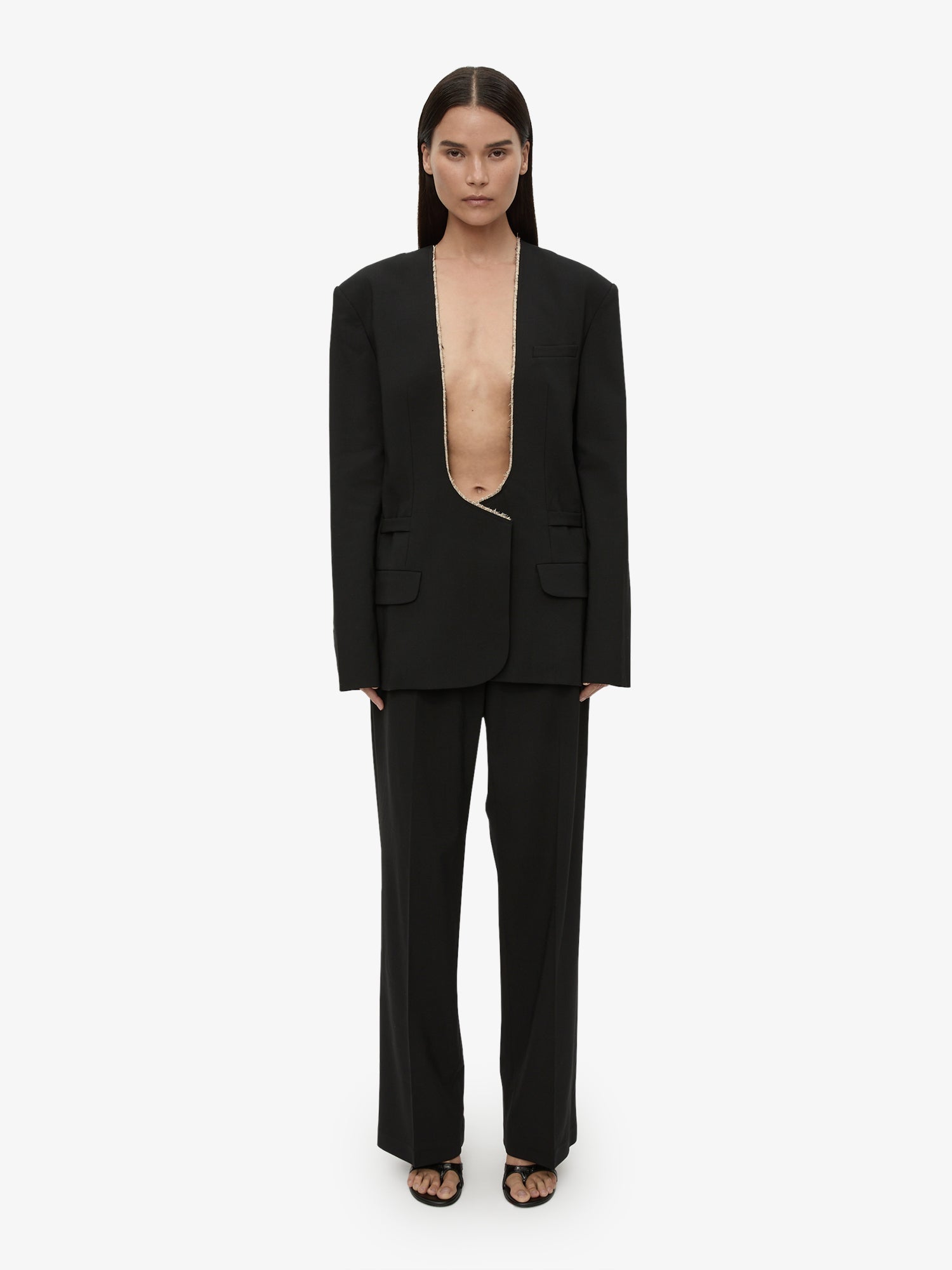 Image of a model wearing Pants. Productname: CHRISTOPHER ESBER Redux Wool Trouser in Black colour by brand - CHRISTOPHER ESBER
