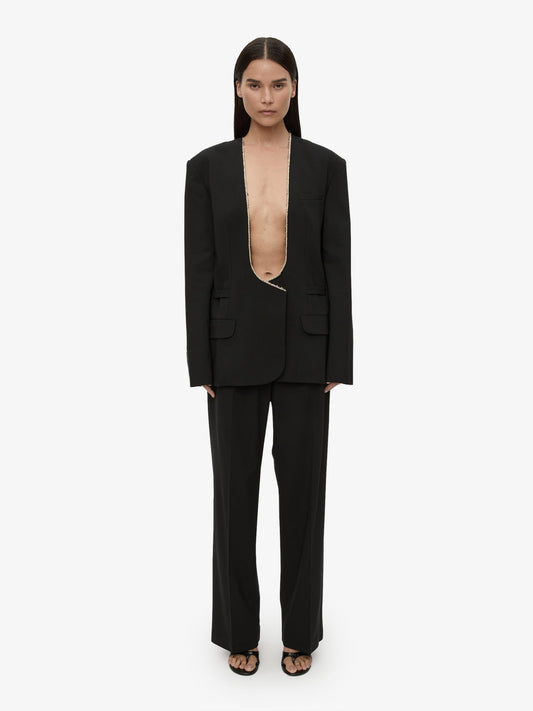 Image of a model wearing Pants. Productname: CHRISTOPHER ESBER Redux Wool Trouser in Black colour by brand - CHRISTOPHER ESBER