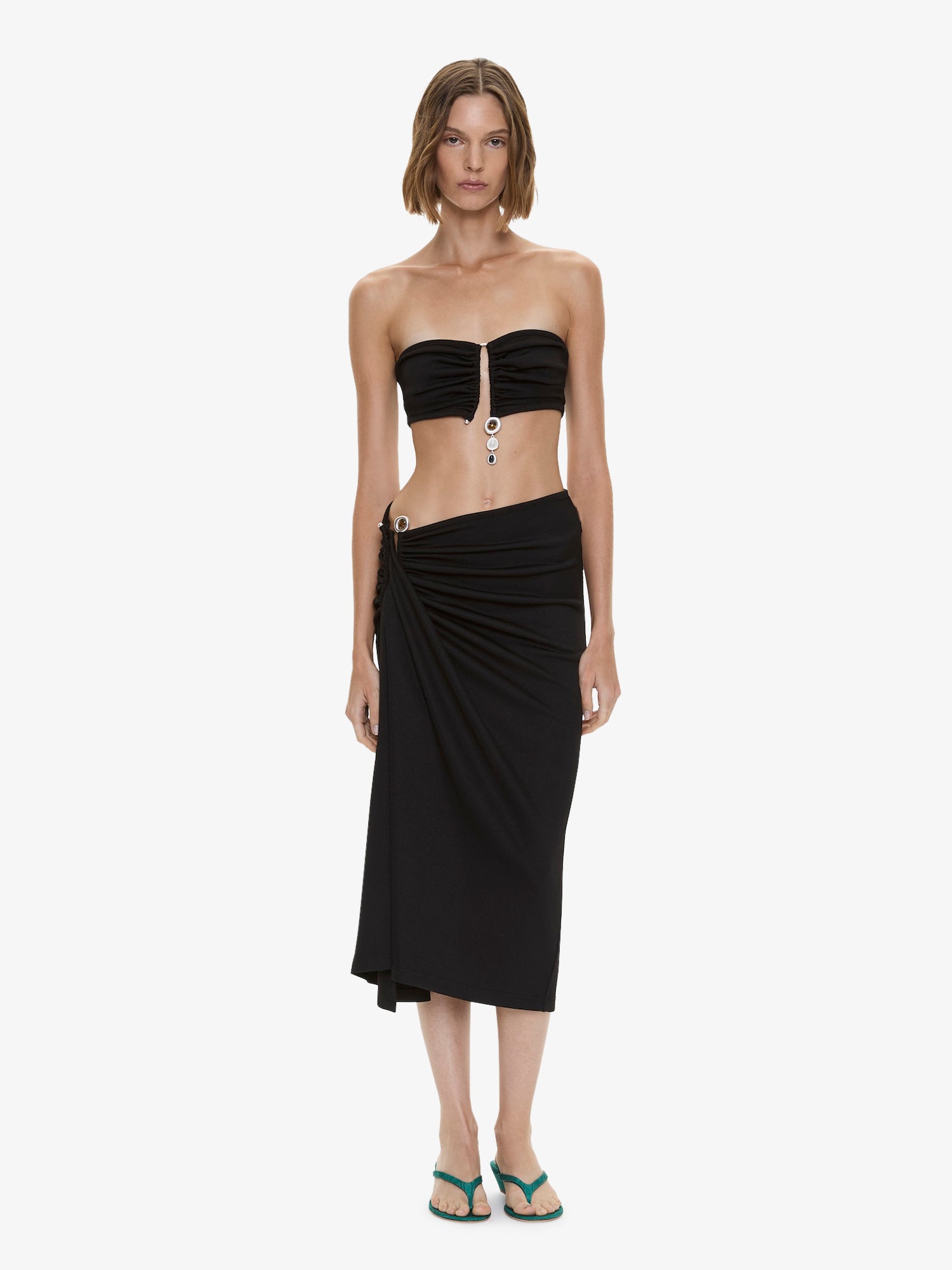 Image of a model wearing Skirts. Product name - Droplet Crystal Clasp Cascade Skirt in Black colour by brand - CHRISTOPHER ESBER