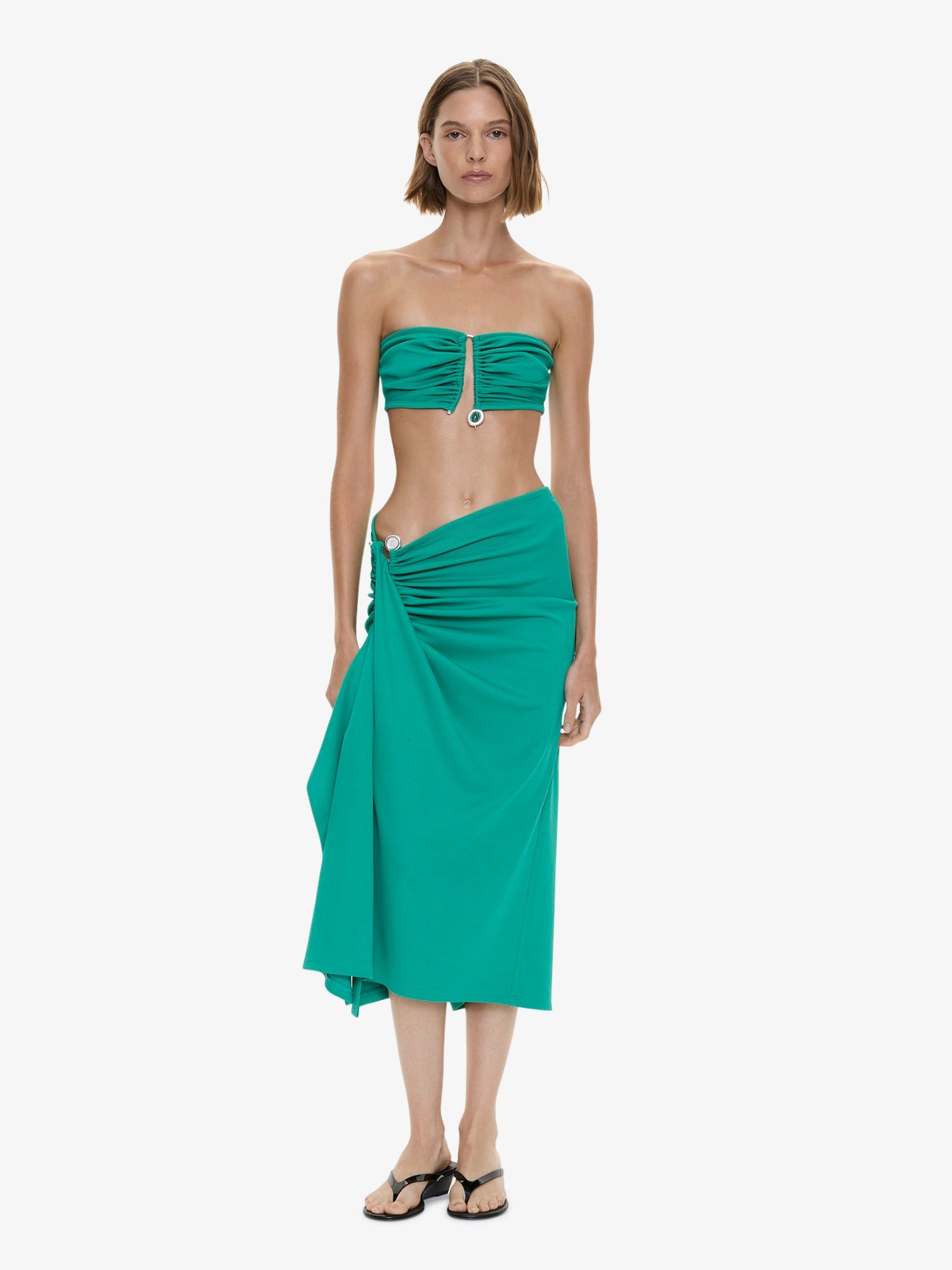 Image of a model wearing Skirts. Product name - Droplet Crystal Clasp Cascade Skirt in Malachite colour by brand - CHRISTOPHER ESBER