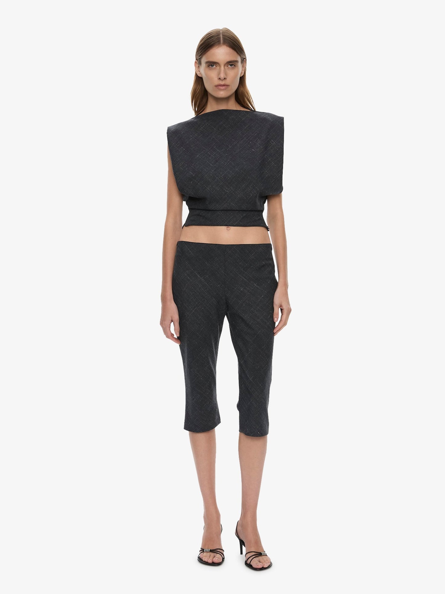 Image of a model wearing Shorts. Product name - Banyan Capri Pant in Marle colour by brand - CHRISTOPHER ESBER
